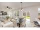 Dining area with a dark brown table and chairs, and access to the backyard at 3008 Sadler Woods Ln, Charlotte, NC 28214