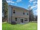 Two-story gray house with a backyard, patio, and landscaping at 3008 Sadler Woods Ln, Charlotte, NC 28214