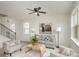 Living room with gray sofa and access to upstairs at 3008 Sadler Woods Ln, Charlotte, NC 28214