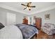 Large bedroom with hardwood floors and ceiling fan at 301 W 10Th St # 205, Charlotte, NC 28202