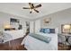 Bright bedroom with hardwood floors and ceiling fan at 301 W 10Th St # 205, Charlotte, NC 28202