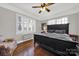 Spacious bedroom with hardwood floors and large bed at 301 W 10Th St # 205, Charlotte, NC 28202