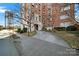 Brick building exterior with landscaping and entrance at 301 W 10Th St # 205, Charlotte, NC 28202