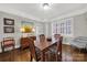 Charming dining room with hardwood floors and a window seat at 301 W 10Th St # 205, Charlotte, NC 28202