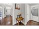 Long hallway with hardwood floors and art pieces at 301 W 10Th St # 205, Charlotte, NC 28202