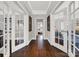 Hardwood floor hallway with white doors and gray walls at 301 W 10Th St # 205, Charlotte, NC 28202