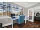 Bright home office features a large window and comfortable seating at 301 W 10Th St # 205, Charlotte, NC 28202