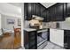 Modern kitchen with black cabinets and stainless steel appliances at 301 W 10Th St # 205, Charlotte, NC 28202