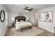 Spacious bedroom with king bed, ensuite bathroom access, and stylish decor at 3016 Sadler Woods Ln, Charlotte, NC 28214