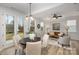 Kitchen and dining area with hardwood floors and a round dining table at 3016 Sadler Woods Ln, Charlotte, NC 28214