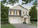 Two-story house with beige siding, gray shutters, and a two-car garage at 3016 Sadler Woods Ln, Charlotte, NC 28214