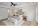 Bright bedroom with hardwood floors and an en-suite bathroom at 3020 Sadler Woods Ln, Charlotte, NC 28214