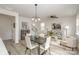 Open dining room adjacent to the living room and kitchen at 3020 Sadler Woods Ln, Charlotte, NC 28214