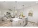 Open kitchen with island, stainless steel appliances, and white cabinets at 3020 Sadler Woods Ln, Charlotte, NC 28214