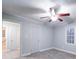 Bright bedroom with ceiling fan, carpet, and ample closet space at 315 W Clairmont St, Troy, NC 27371