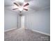 Bedroom with ceiling fan and neutral decor at 315 W Clairmont St, Troy, NC 27371