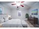 Main bedroom with plush bed, dresser, and natural light at 315 W Clairmont St, Troy, NC 27371