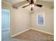 Simple bedroom with neutral walls and carpeting at 315 W Clairmont St, Troy, NC 27371