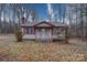 Ranch home with wood siding and a covered porch at 315 W Clairmont St, Troy, NC 27371