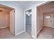 Hallway with doors to bedrooms and access to other areas at 315 W Clairmont St, Troy, NC 27371