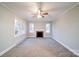 Living room with fireplace and neutral carpeting at 315 W Clairmont St, Troy, NC 27371