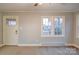 Living room with neutral walls and carpeting at 315 W Clairmont St, Troy, NC 27371