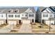 Townhome community view showcasing multiple two-story homes and landscaping at 3323 Glenn Hope Way, Matthews, NC 28104