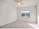 Well-lit bedroom with a large window and carpet flooring at 3323 Glenn Hope Way, Matthews, NC 28104