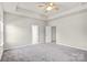 Well-lit bedroom with access to bathroom and another room at 3323 Glenn Hope Way, Matthews, NC 28104