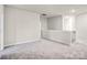 Carpeted loft area with access to multiple rooms at 3323 Glenn Hope Way, Matthews, NC 28104