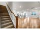 Carpeted staircase leading to open living area with hardwood floors at 3323 Glenn Hope Way, Matthews, NC 28104