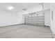 This garage has a garage door and concrete flooring at 3705 Lou Ann Ave, Charlotte, NC 28208