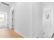 This hallway has wood look flooring, white walls and white doors at 3705 Lou Ann Ave, Charlotte, NC 28208