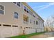 Townhome building with attached garages and grassy area at 3709 Lou Ann Ave, Charlotte, NC 28208