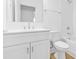 A bathroom with a white vanity, toilet, bathtub and shower with white subway tile at 3713 Lou Ann Ave, Charlotte, NC 28208