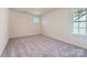 Bedroom with gray carpet and a window offering natural light at 4540 Dusty Orchard Rd, Kannapolis, NC 28081