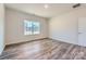 Bright bedroom with hardwood floors and a large window at 4540 Dusty Orchard Rd, Kannapolis, NC 28081