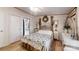 Cozy bedroom with rustic decor and ensuite bathroom access at 5120 Gates Dr, Denver, NC 28037