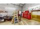 Workshop area with motorcycle, tool chest, and ladder at 5120 Gates Dr, Denver, NC 28037