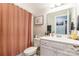 Clean bathroom with a shower/tub combo and white vanity at 5158 Turtle Creek Dr, Denver, NC 28037