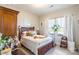 Cozy bedroom with a full-size bed and storage drawers at 5158 Turtle Creek Dr, Denver, NC 28037