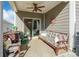 Covered patio with seating area and ceiling fan at 5158 Turtle Creek Dr, Denver, NC 28037