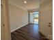 Bright dining area with luxury vinyl plank flooring, sliding glass doors leading to the outdoor area at 5552 Stafford Rd # 28, Charlotte, NC 28215