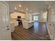 Modern kitchen with white cabinets, stainless steel appliances, a center island, and a seamless flow to the living areas at 5552 Stafford Rd # 28, Charlotte, NC 28215