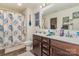 Clean bathroom with double vanity and shower/tub combo at 612 Spencer Ln, Kannapolis, NC 28081