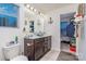 Modern bathroom with double vanity and access to walk-in closet at 612 Spencer Ln, Kannapolis, NC 28081