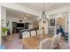 Dining area with a large table, six chairs, and views of the living room at 612 Spencer Ln, Kannapolis, NC 28081