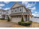 Two-story house with gray siding, brick accents, and a two-car garage at 612 Spencer Ln, Kannapolis, NC 28081