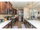 Modern kitchen featuring stainless steel appliances and dark wood cabinets at 612 Spencer Ln, Kannapolis, NC 28081