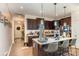 Open kitchen with island seating and views into the adjacent living room at 612 Spencer Ln, Kannapolis, NC 28081